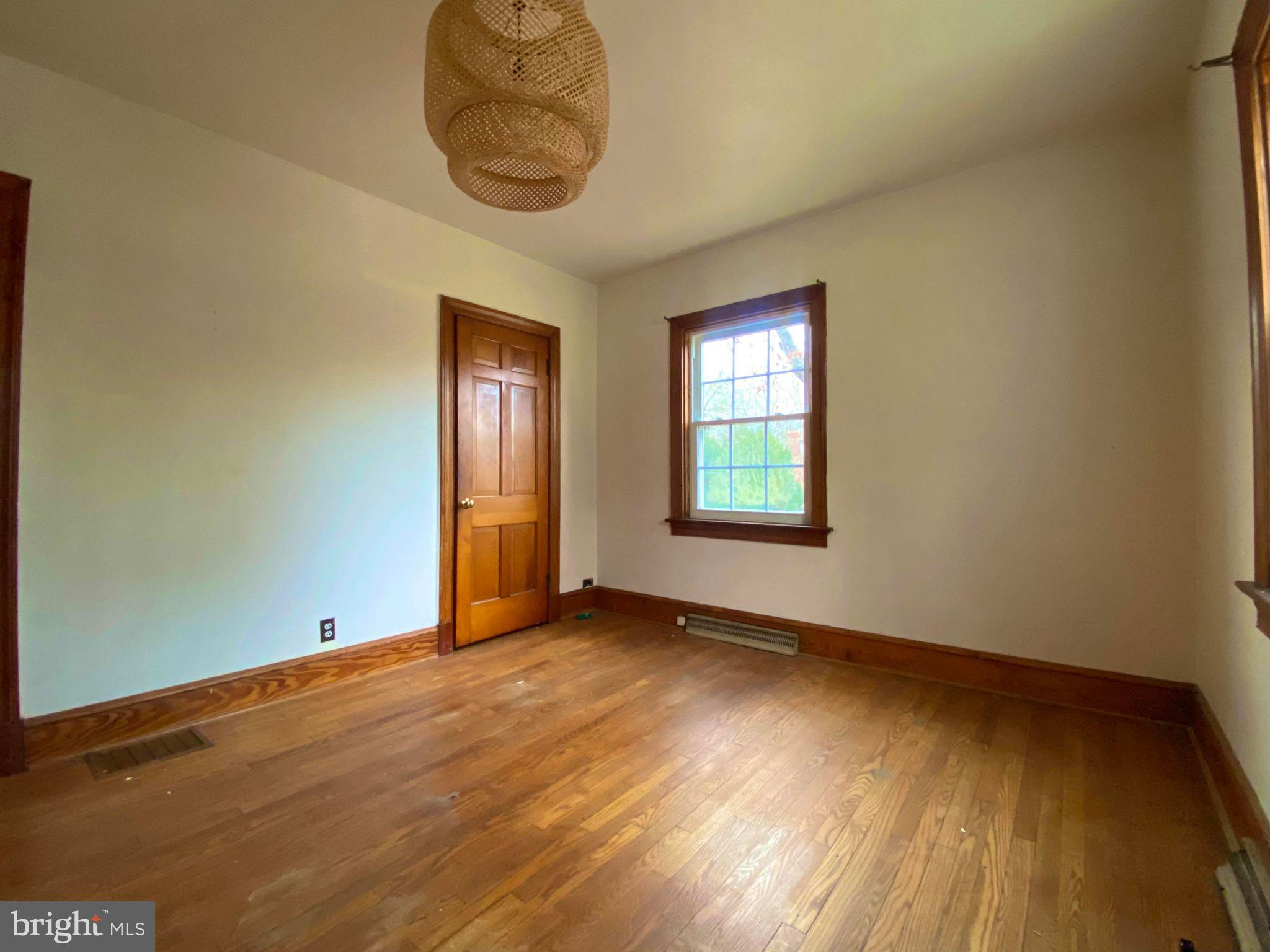 17088 Old Ridge Road Montpelier, VA 23192 - Photo 20 of 38 an empty room with wooden floor and windows