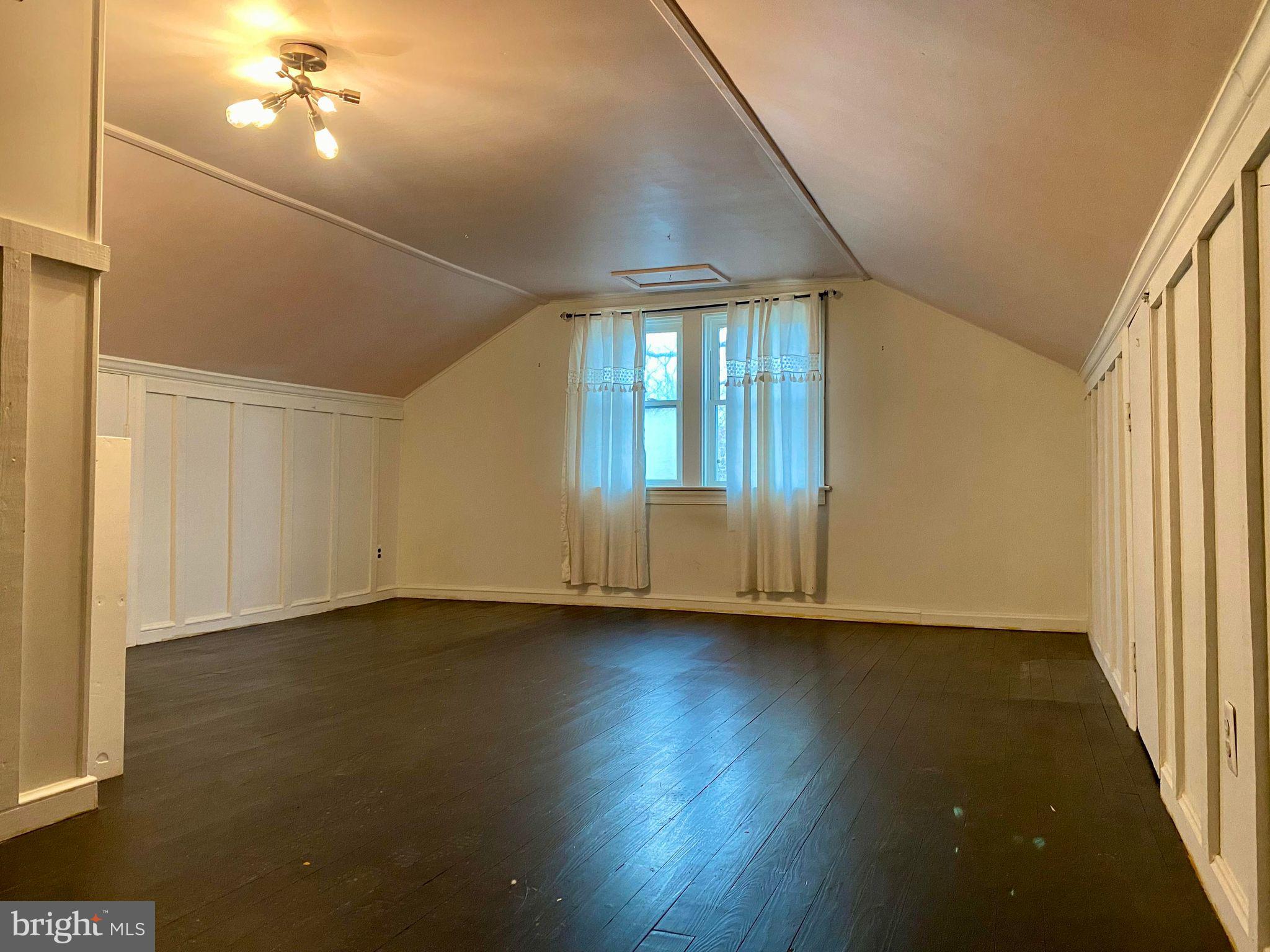 17088 Old Ridge Road Montpelier, VA 23192 - Photo 21 of 38 an empty room with wooden floor and windows