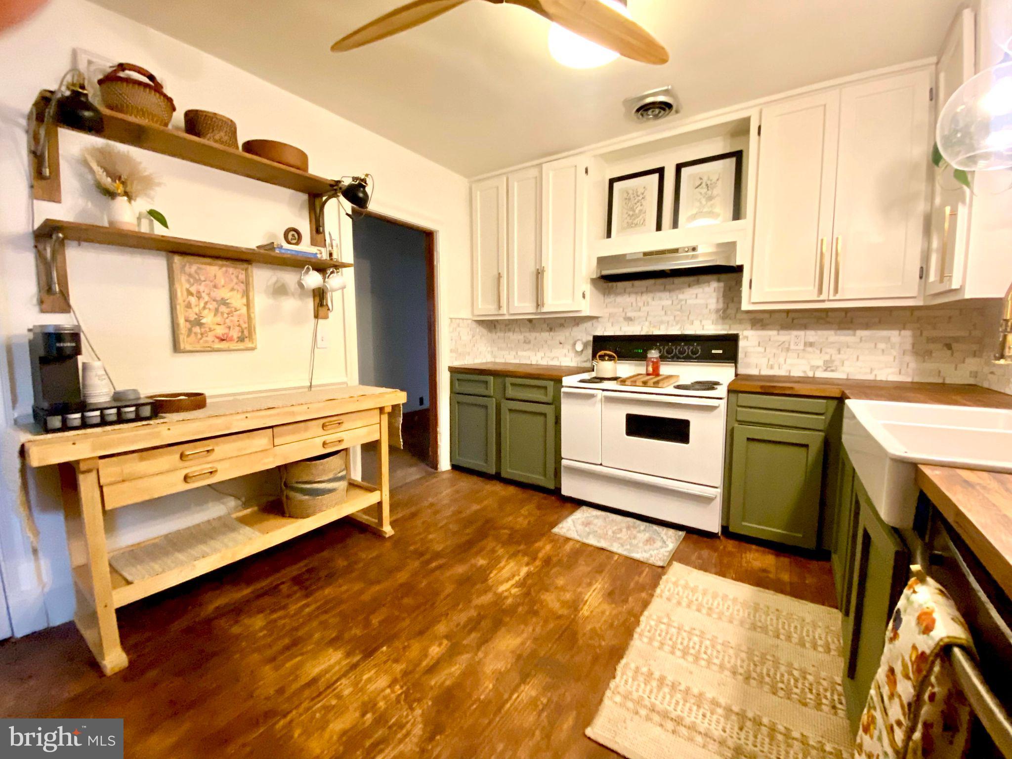 17088 Old Ridge Road Montpelier, VA 23192 - Photo 6 of 38 a kitchen with a stove a sink and a refrigerator