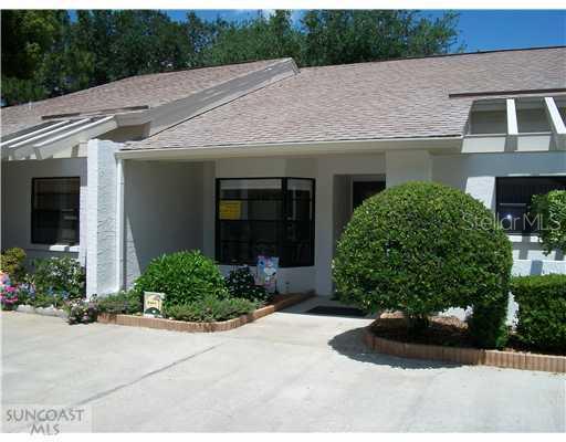 3502 Wedge Way New Port Richey, FL 34655 - Photo 1 of 1 a front view of a house with a yard