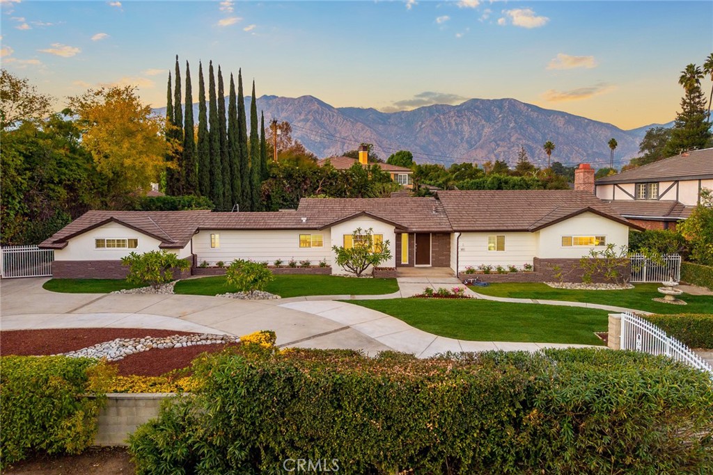 451 West Foothill Boulevard Arcadia, CA 91006 - Photo 1 of 1 a view of multiple houses with a yard and a large tree