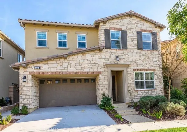 a front view of a house with yard
