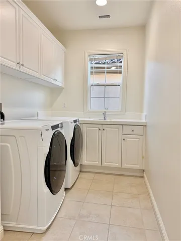 a view of a house with a yard and a garage