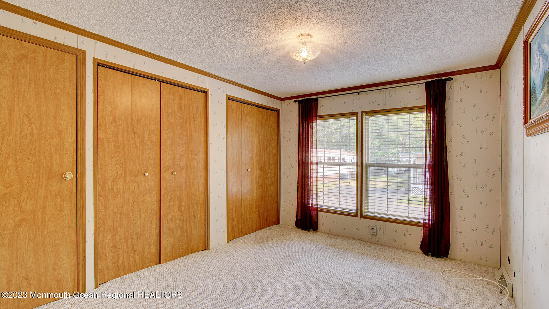 76 Village Road Morganville, NJ 07751 - Photo 8 of 27 a view of an empty room with a window