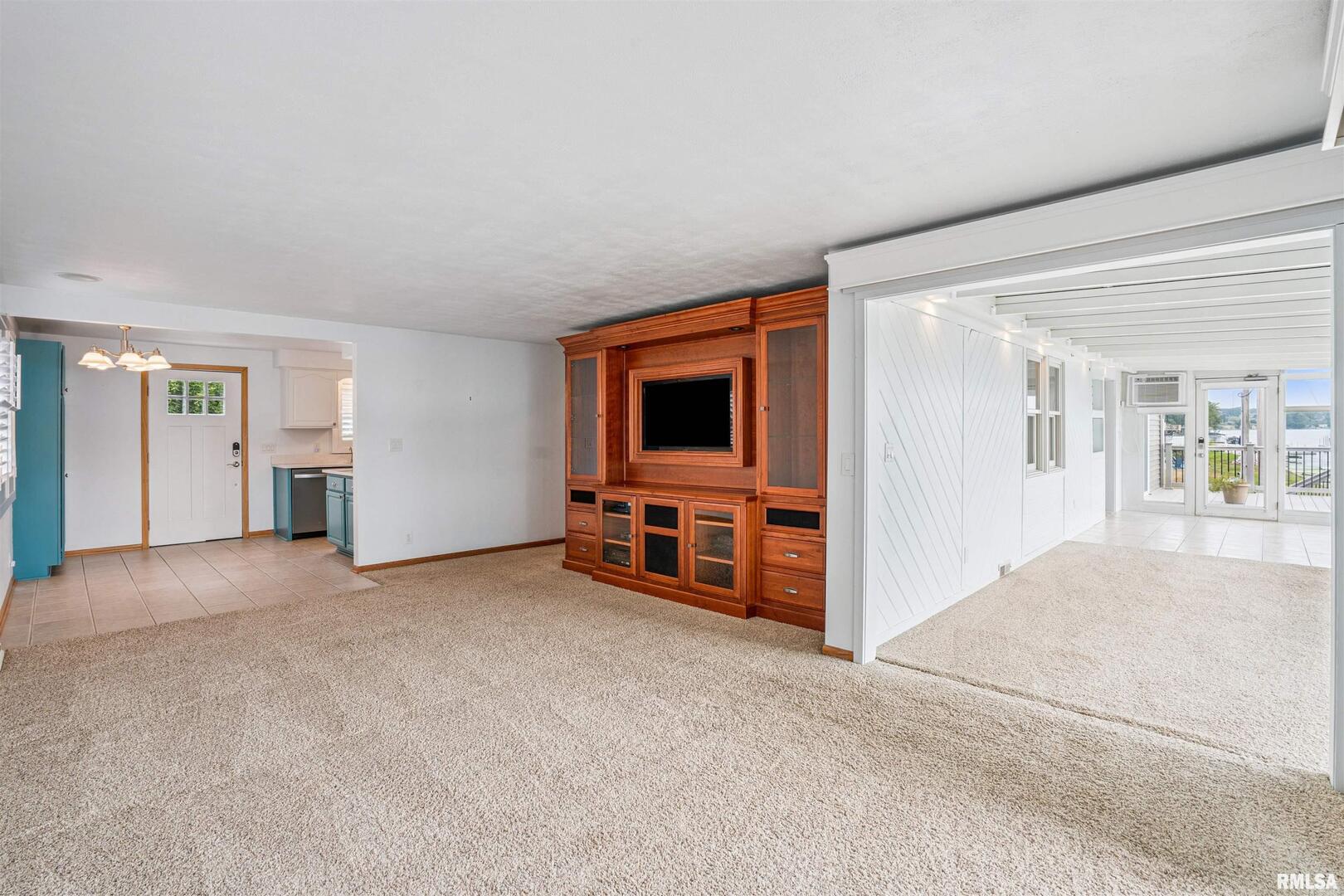 22799 Great River Road Le Claire, IA 52753 - Photo 23 of 48 a view of a livingroom with furniture and an empty room