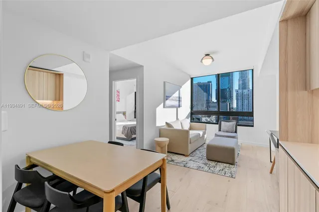 a view of a livingroom with furniture and a table