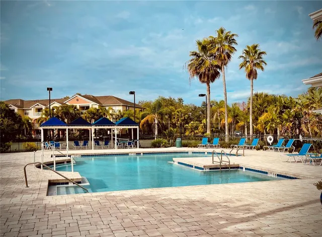 a view of a swimming pool with a patio