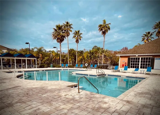 a view of a house with a backyard and a patio