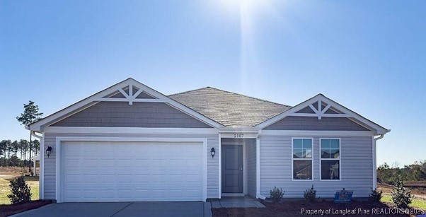 a front view of a house with yard