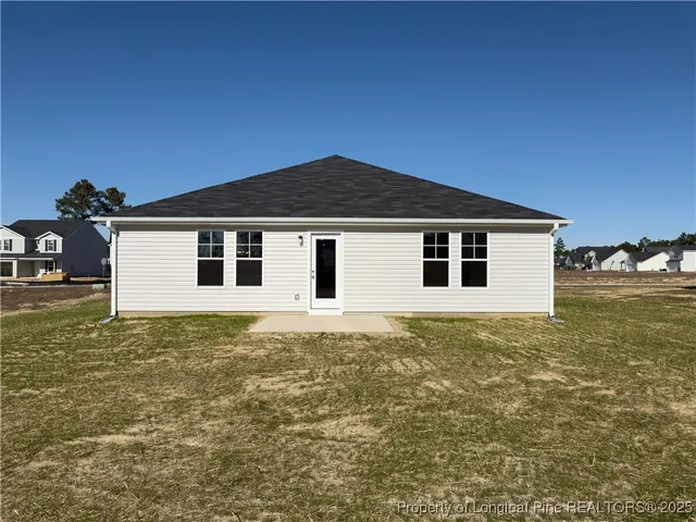 a house with yard in front of it