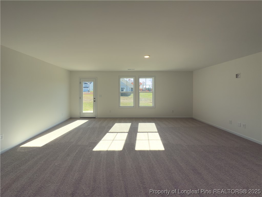 2107 Roadster Pony (lot 43) Lane Hope Mills, NC 28348 - Photo 2 of 17 an empty room with wooden floor and windows