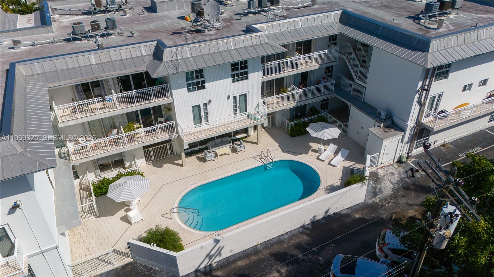 290 Sunrise Drive, Unit 2L Key Biscayne, FL 33149 - Photo 10 of 16 an aerial view of a house with a swimming pool