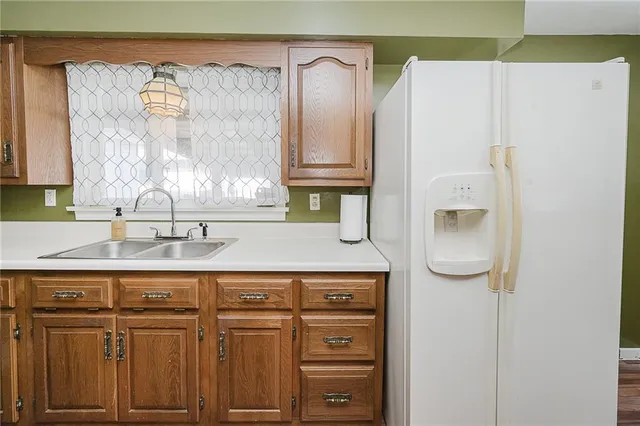 a bathroom with a sink a mirror and a shower