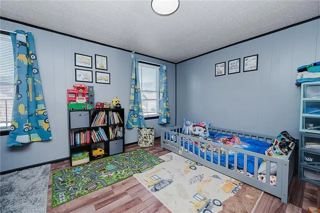 a bedroom with furniture and a book shelf