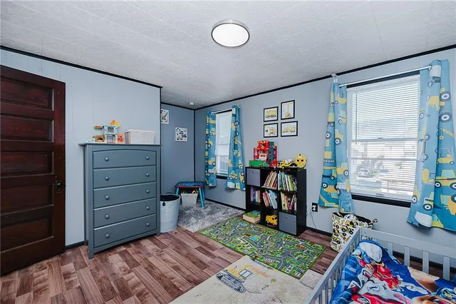 a bedroom with furniture and a window