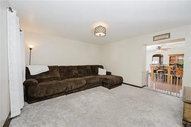 a living room with furniture and a table