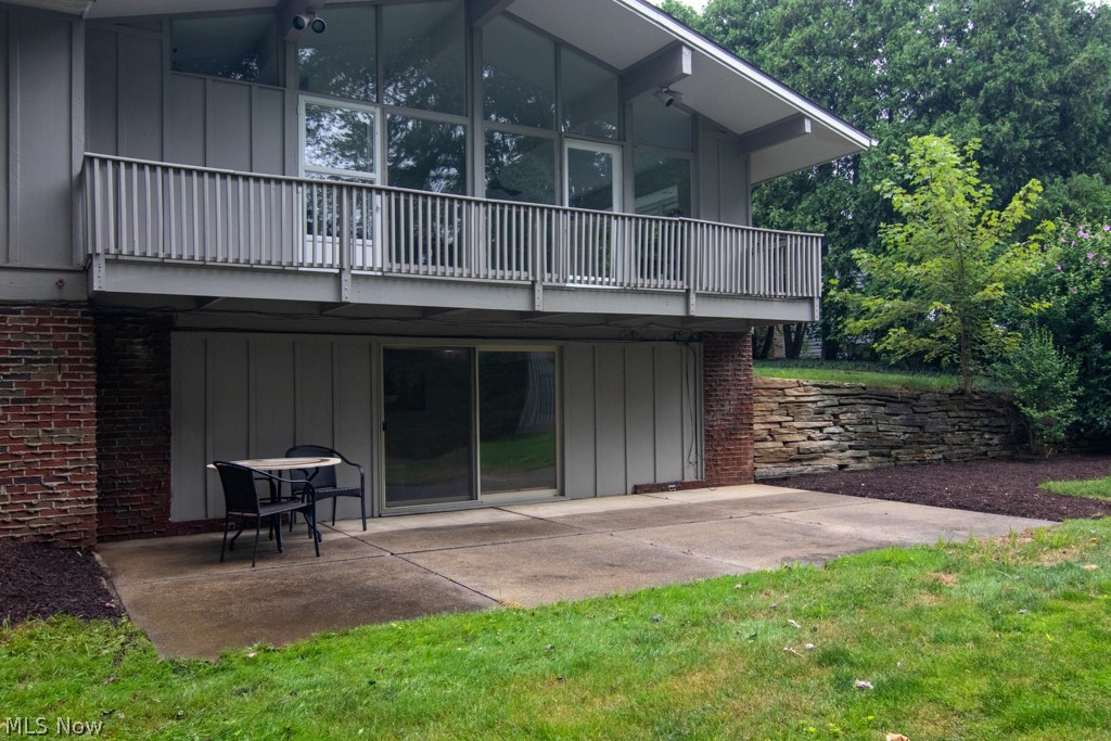 351 Edmore Road Akron, OH 44333 - Photo 35 of 35 A closer view of the back of the home, the large patio off the finished lower level, the stone retainer walls on either side. Make this your next home. Call Today for a Showing!