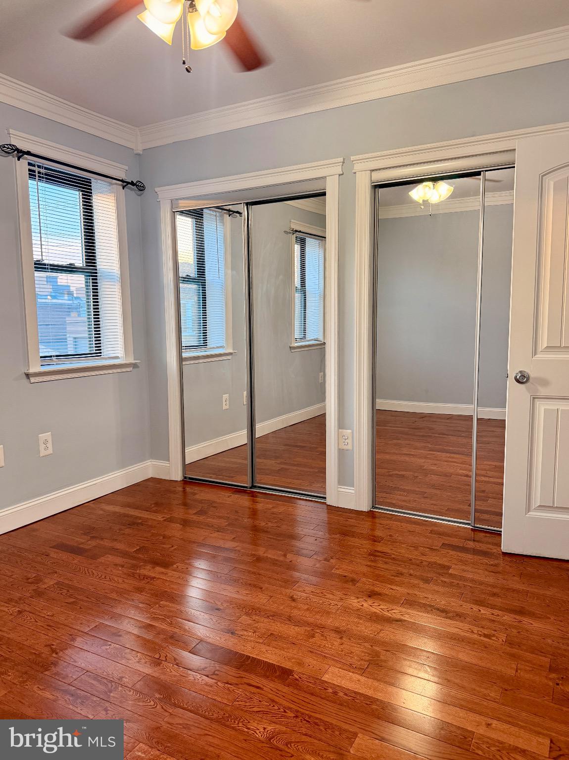 1407 South 28th Street Philadelphia, PA 19146 - Photo 13 of 25 an empty room with wooden floor closet and windows