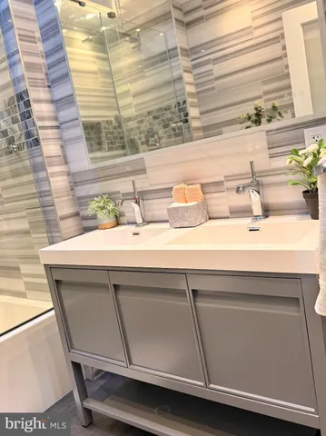 a bathroom with a sink and a window