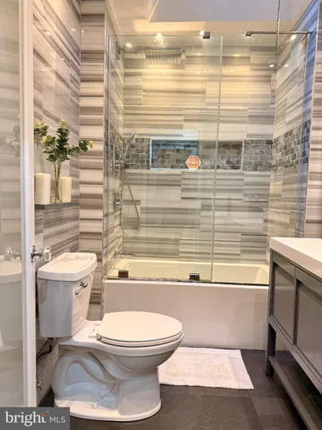 a bathroom with a bathtub and a sink