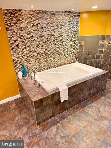 a view of entryway with furniture and a window