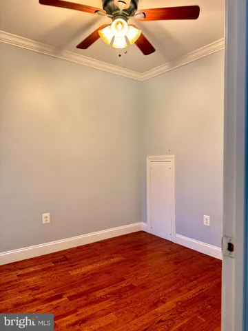 a view of room with wooden floor