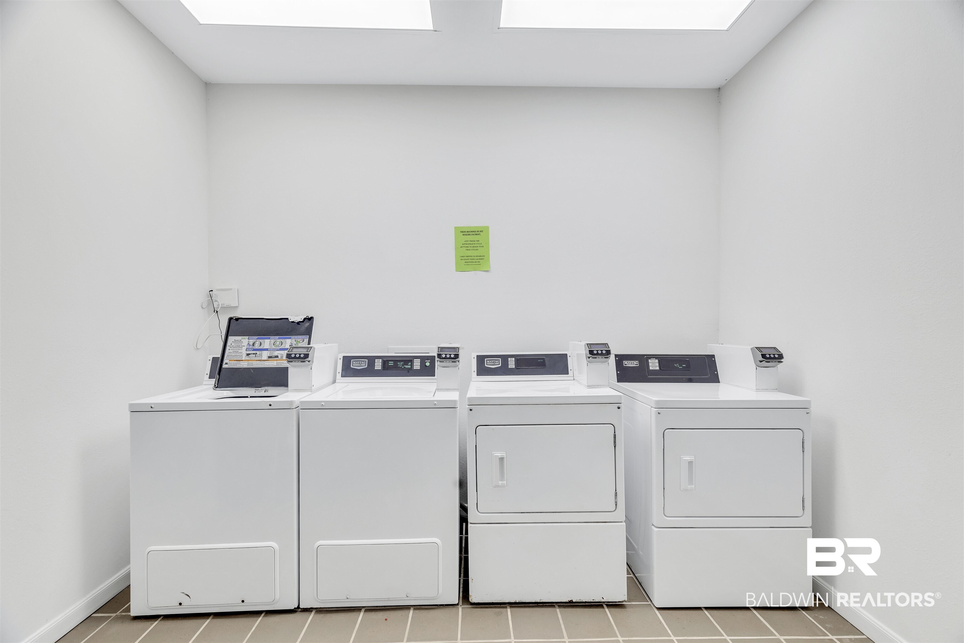 400 Plantation Road, Unit 3314 Gulf Shores, AL 36542 - Photo 38 of 47 Clothes washing area featuring washing machine and dryer and light tile patterned floors