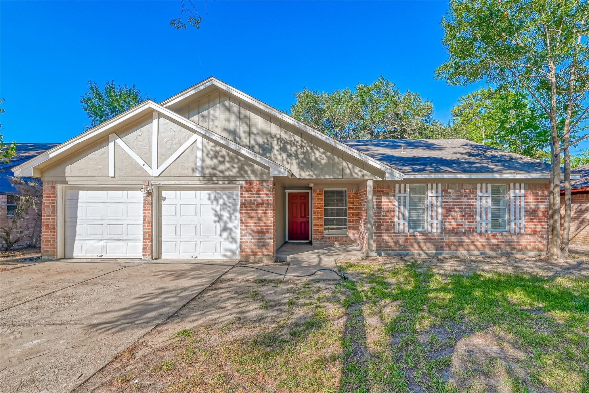 22318 Meadowgate Drive Spring, TX 77373 - Photo 1 of 8 a front view of a house with garden