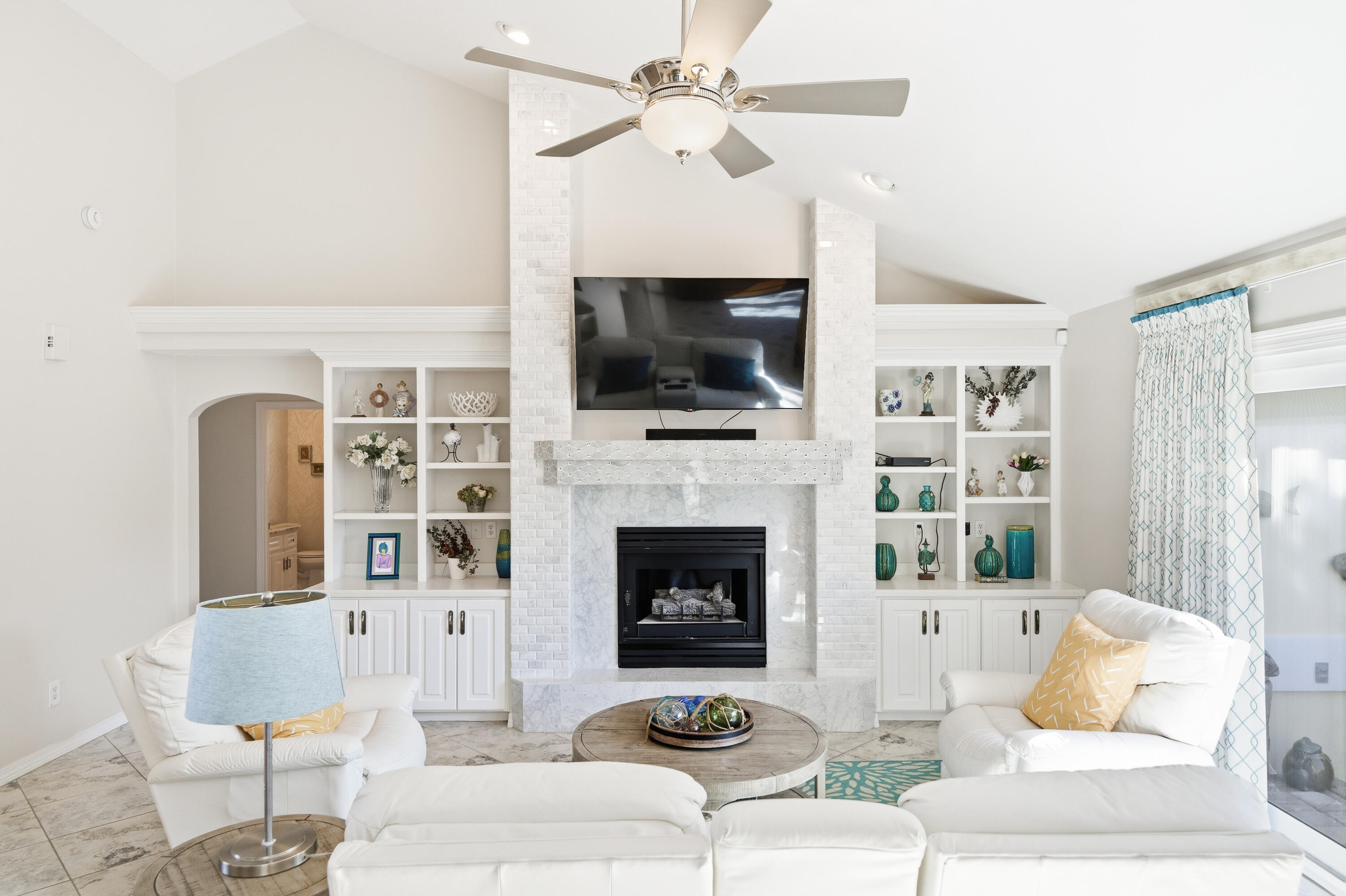 25 Tristram Way Miramar Beach, FL 32550 - Photo 12 of 50 a living room with furniture a flat screen tv and a fireplace