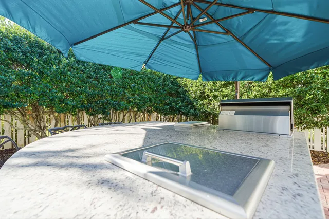 a kitchen with stainless steel appliances granite countertop a stove and a refrigerator