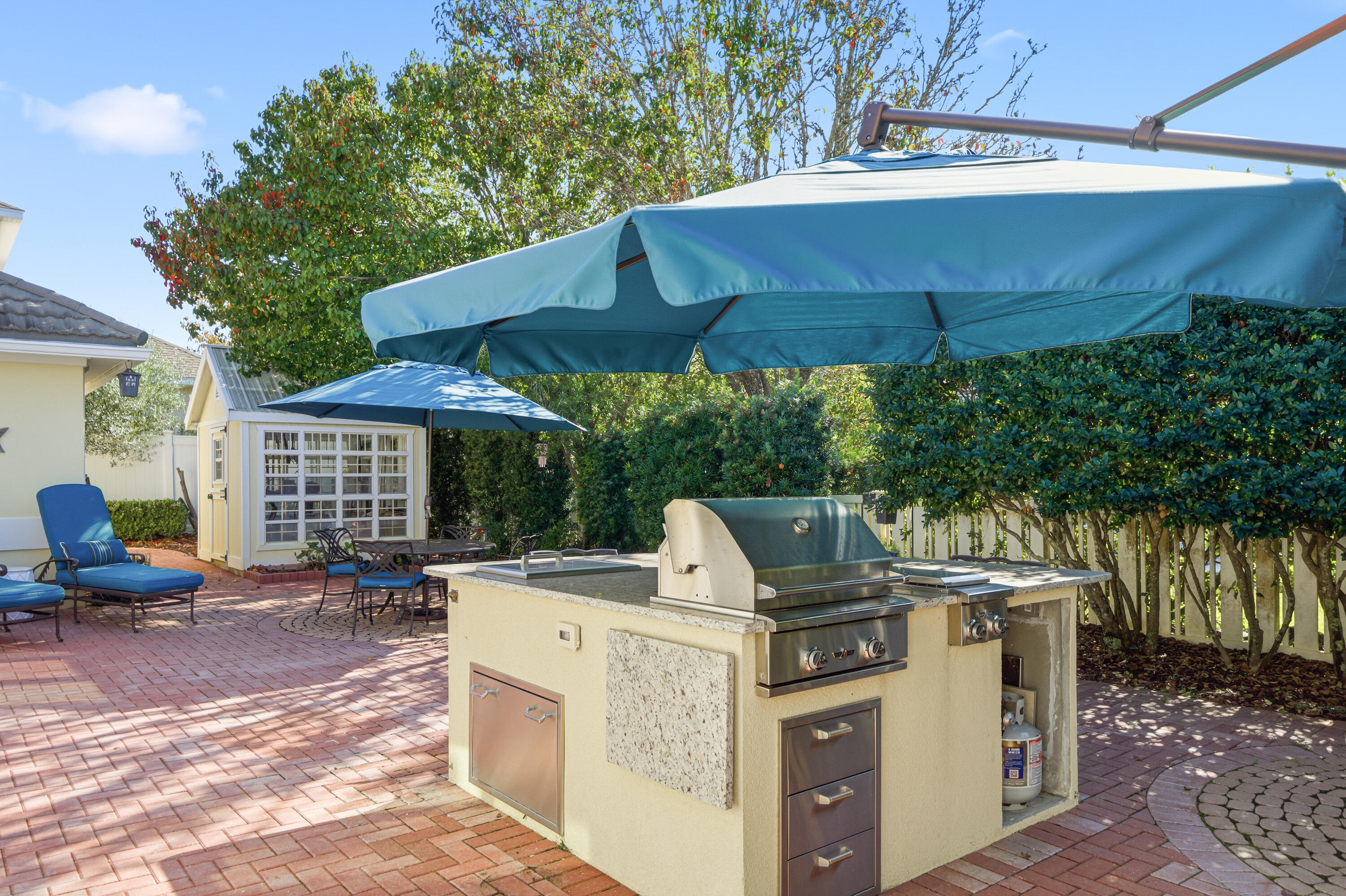 25 Tristram Way Miramar Beach, FL 32550 - Photo 17 of 50 a view of a patio with table and chairs under an umbrella