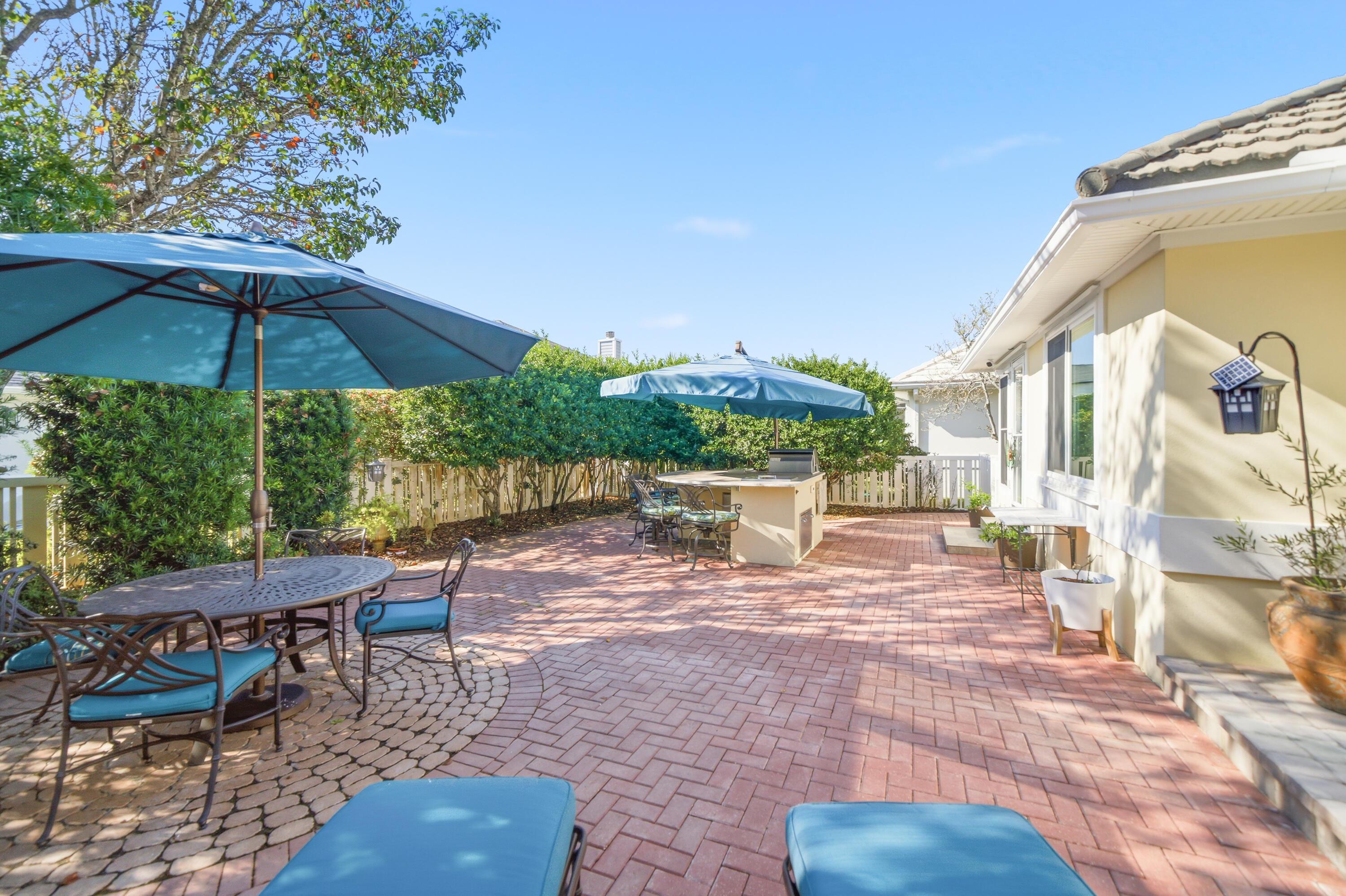 25 Tristram Way Miramar Beach, FL 32550 - Photo 25 of 50 a view of a patio with a table and chairs under an umbrella