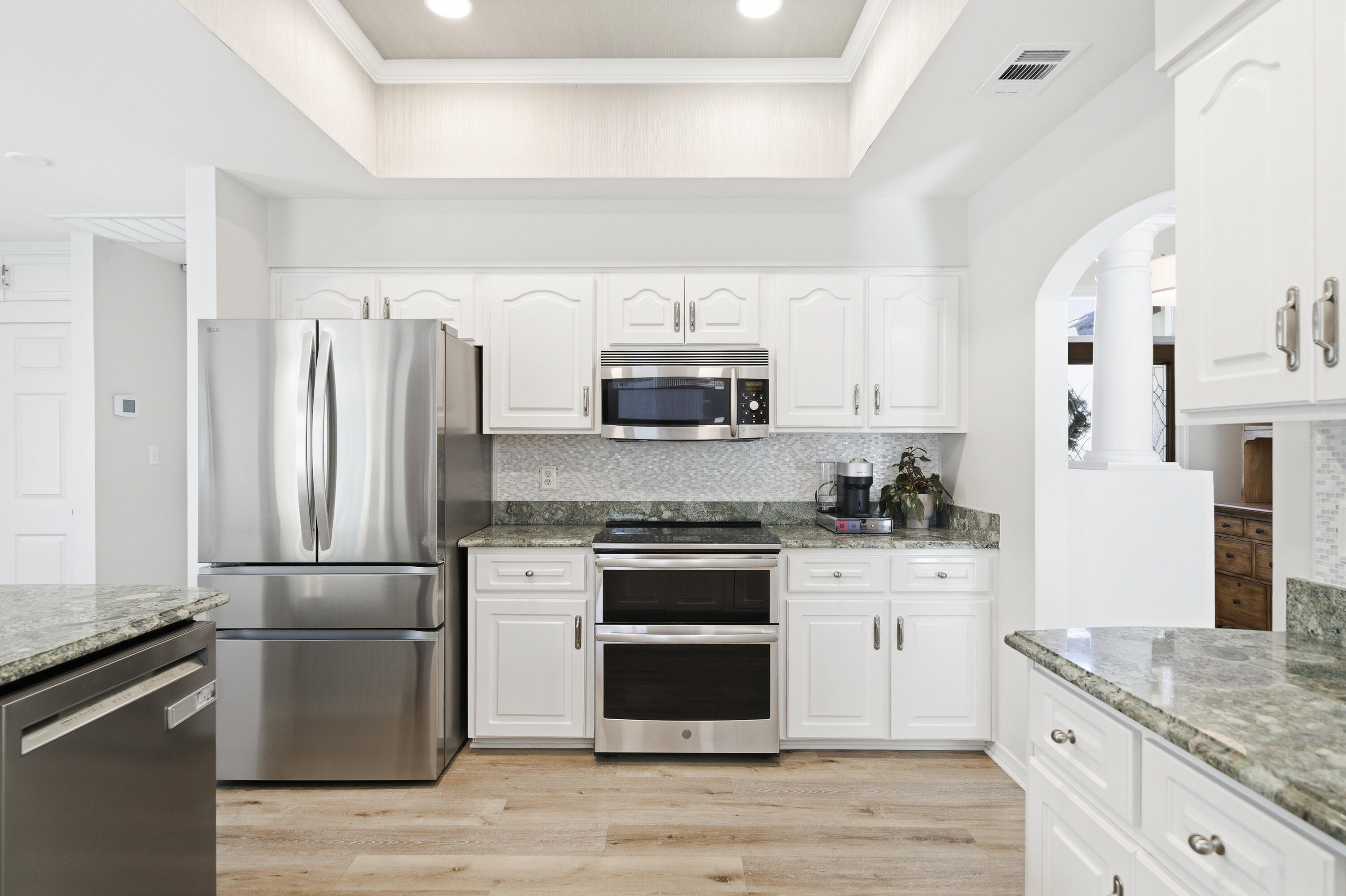 25 Tristram Way Miramar Beach, FL 32550 - Photo 30 of 50 a kitchen with stainless steel appliances granite countertop a stove and a refrigerator
