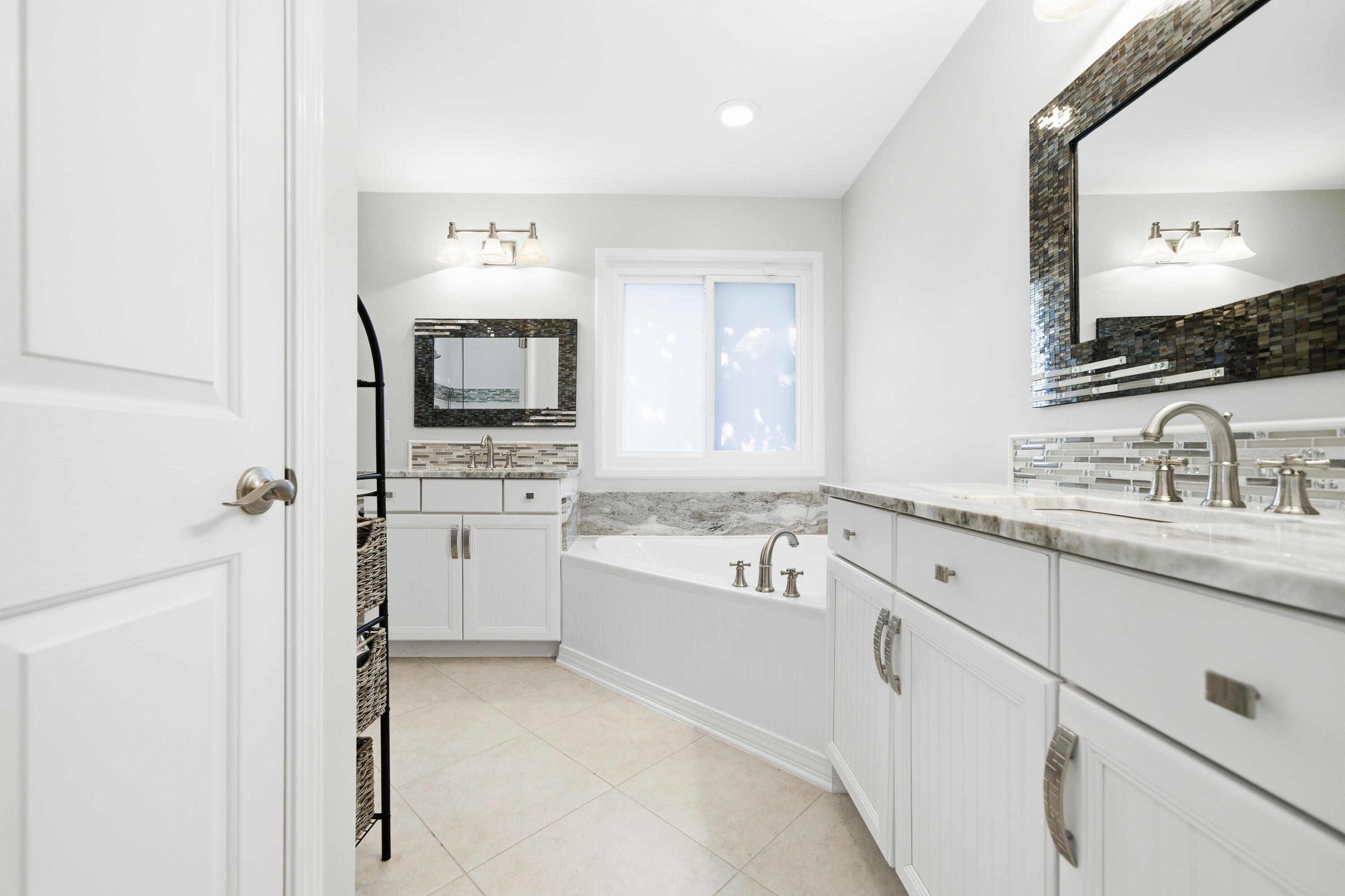 25 Tristram Way Miramar Beach, FL 32550 - Photo 36 of 50 a bathroom with a granite countertop sink mirror and bathtub