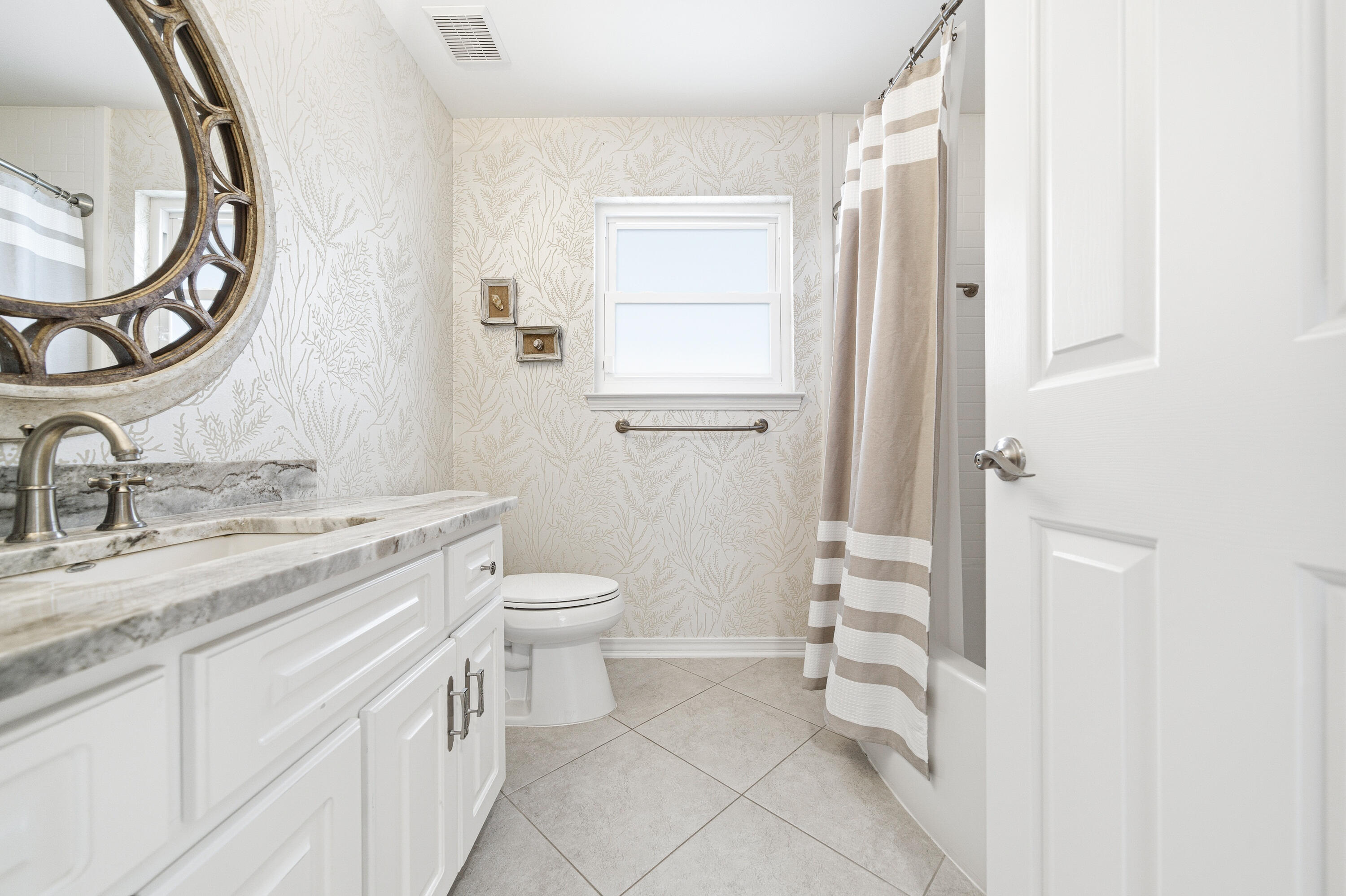 25 Tristram Way Miramar Beach, FL 32550 - Photo 42 of 50 a bathroom with a granite countertop sink toilet and a mirror