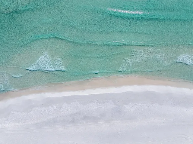 a living room with fireplace furniture and a window