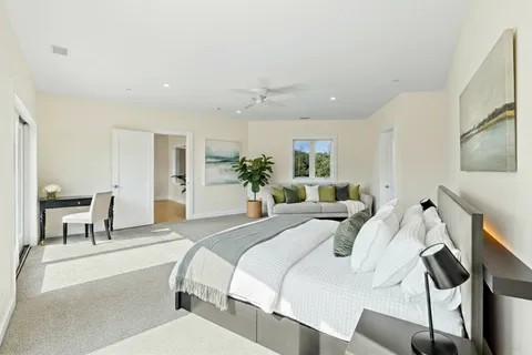 a view of a house with swimming pool and a yard