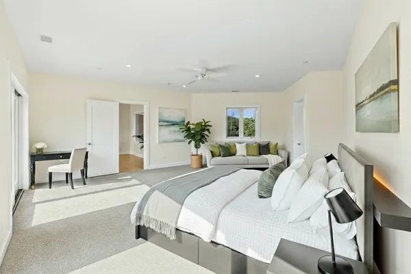 a view of a house with swimming pool and a yard