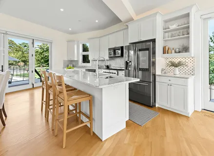 a spacious bedroom with a bed and a couch