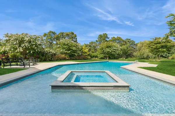 a spacious bedroom with a bed and a couch