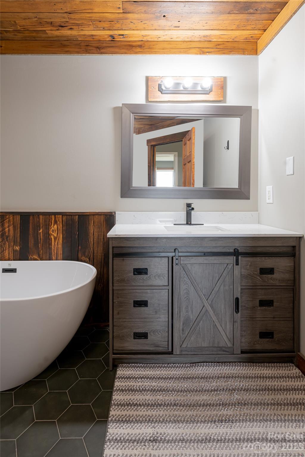 142 Blake Drive Canton, NC 28716 - Photo 11 of 44 a bathroom with a sink and a mirror