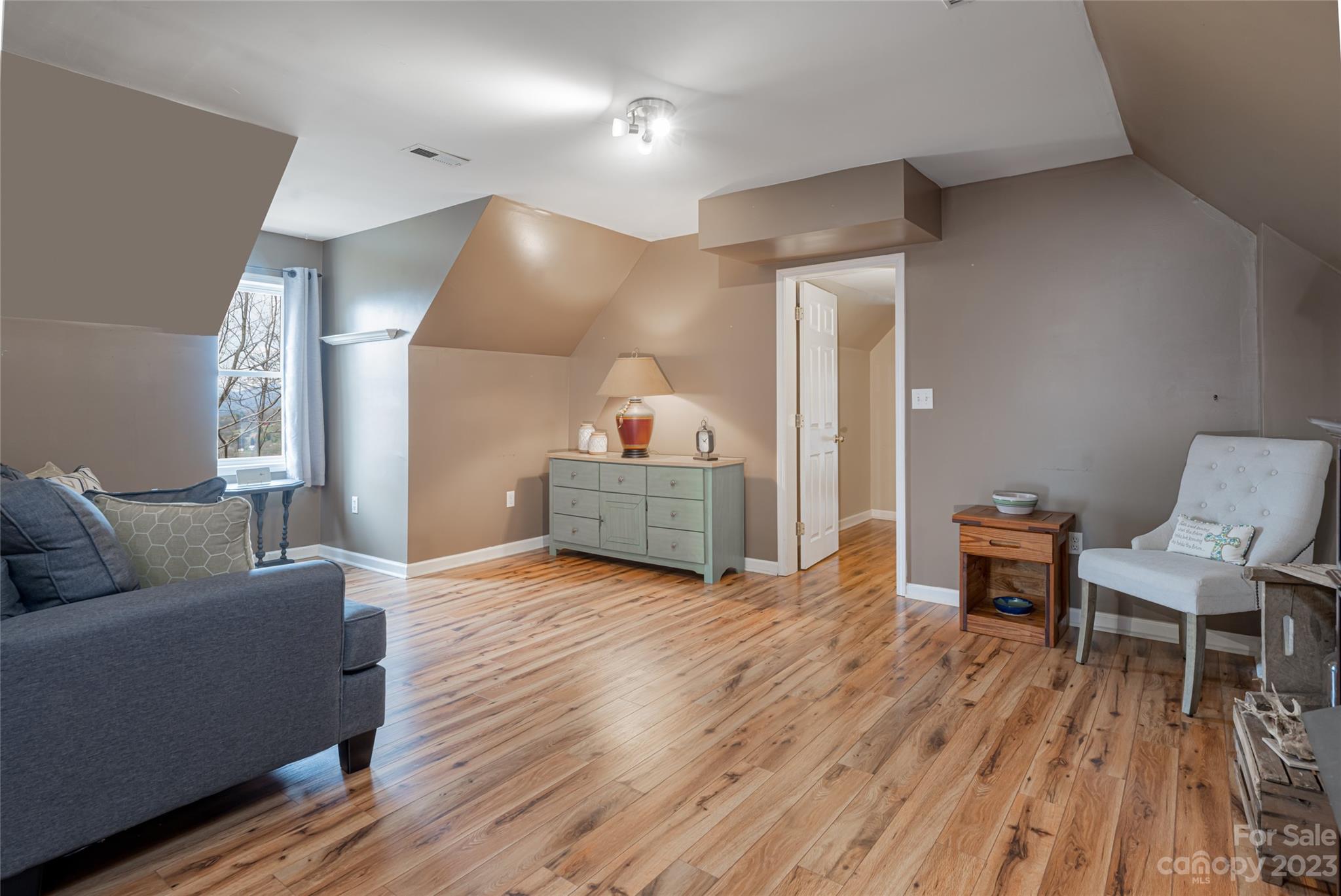 142 Blake Drive Canton, NC 28716 - Photo 17 of 44 a living room with furniture and a wooden floor