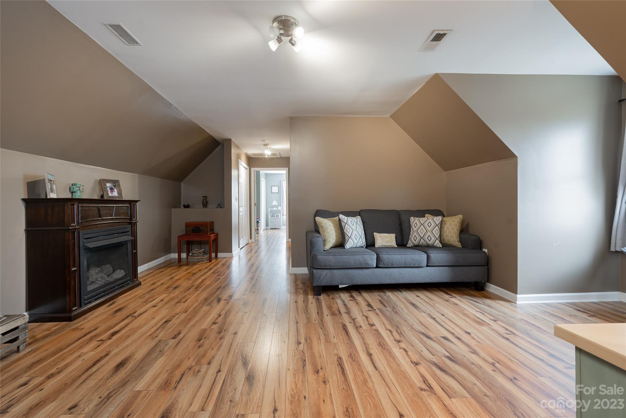 142 Blake Drive Canton, NC 28716 - Photo 18 of 44 a living room with furniture and a fireplace