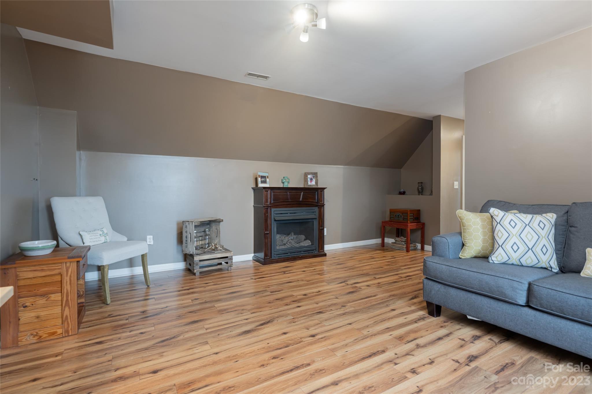 142 Blake Drive Canton, NC 28716 - Photo 19 of 44 a living room with furniture and a fireplace