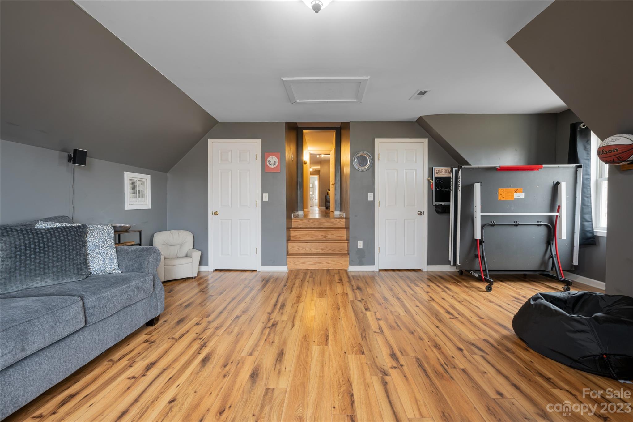 142 Blake Drive Canton, NC 28716 - Photo 20 of 44 a bedroom with a bed and gym equipment