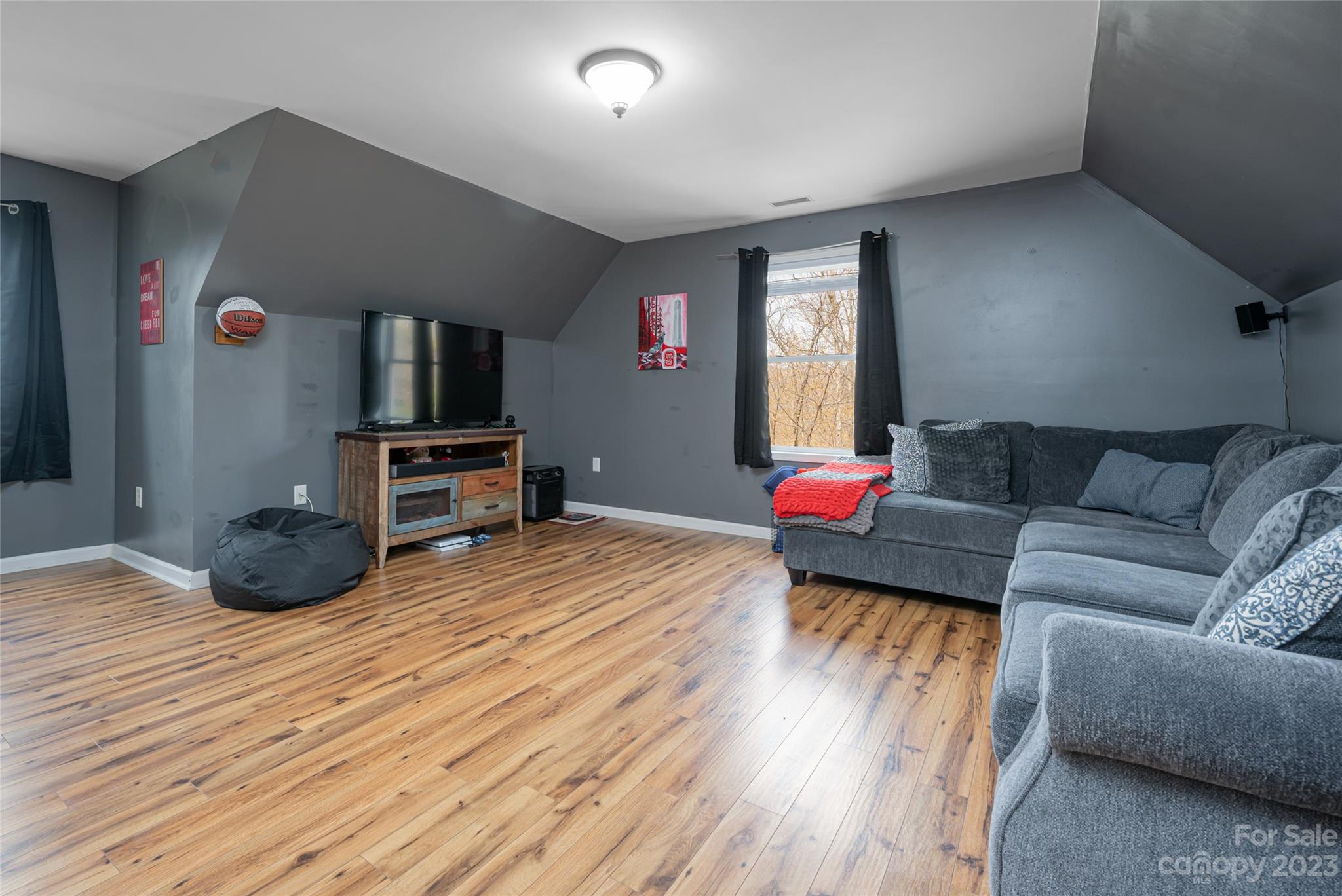 142 Blake Drive Canton, NC 28716 - Photo 21 of 44 a living room with furniture and a flat screen tv