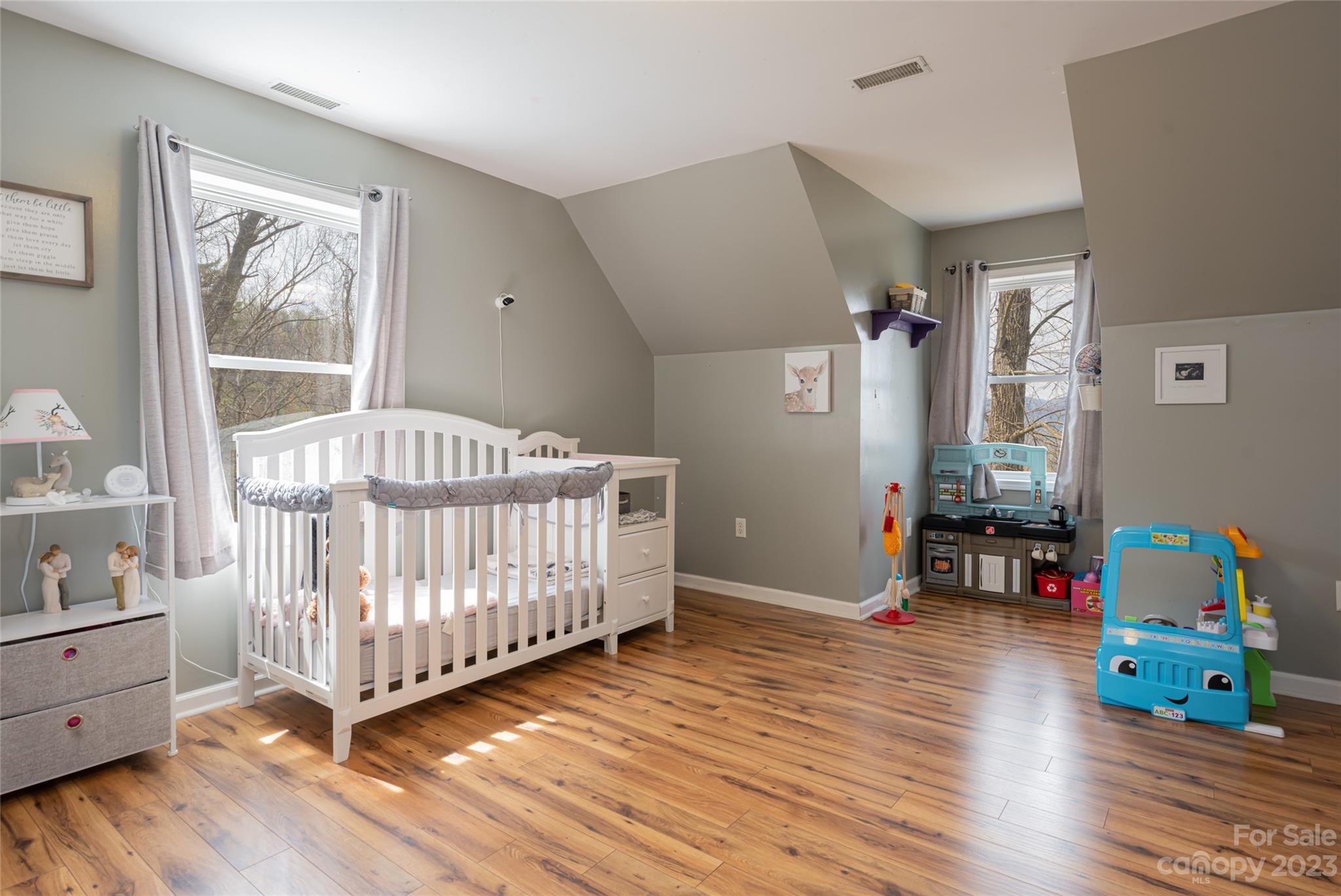 142 Blake Drive Canton, NC 28716 - Photo 24 of 44 a bedroom with baby crib and wooden floor
