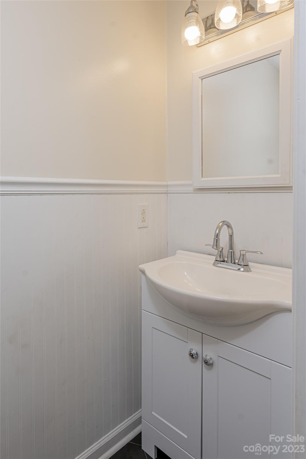 142 Blake Drive Canton, NC 28716 - Photo 25 of 44 a bathroom with a sink and mirror