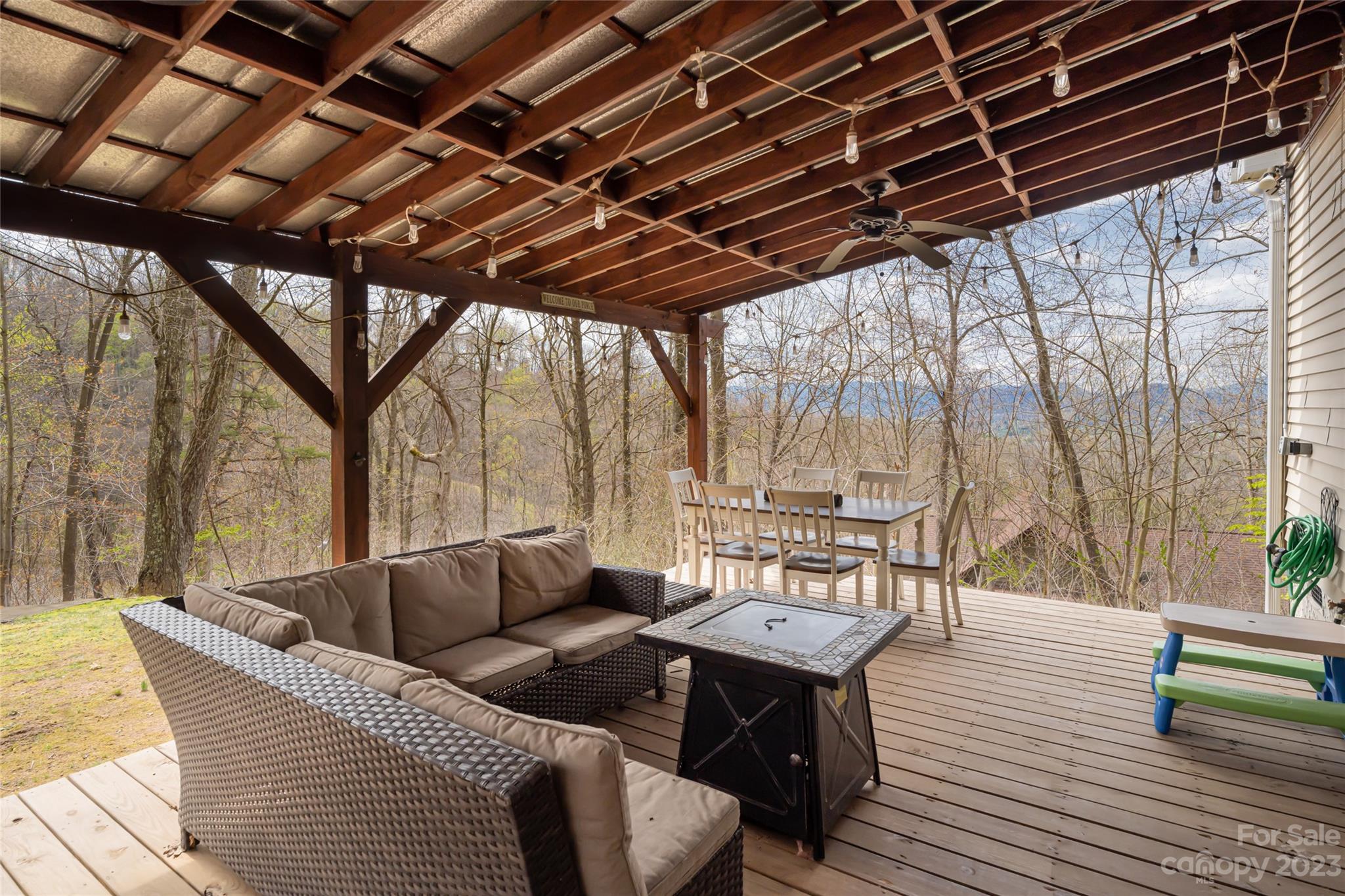 142 Blake Drive Canton, NC 28716 - Photo 31 of 44 a roof deck with couch and chairs