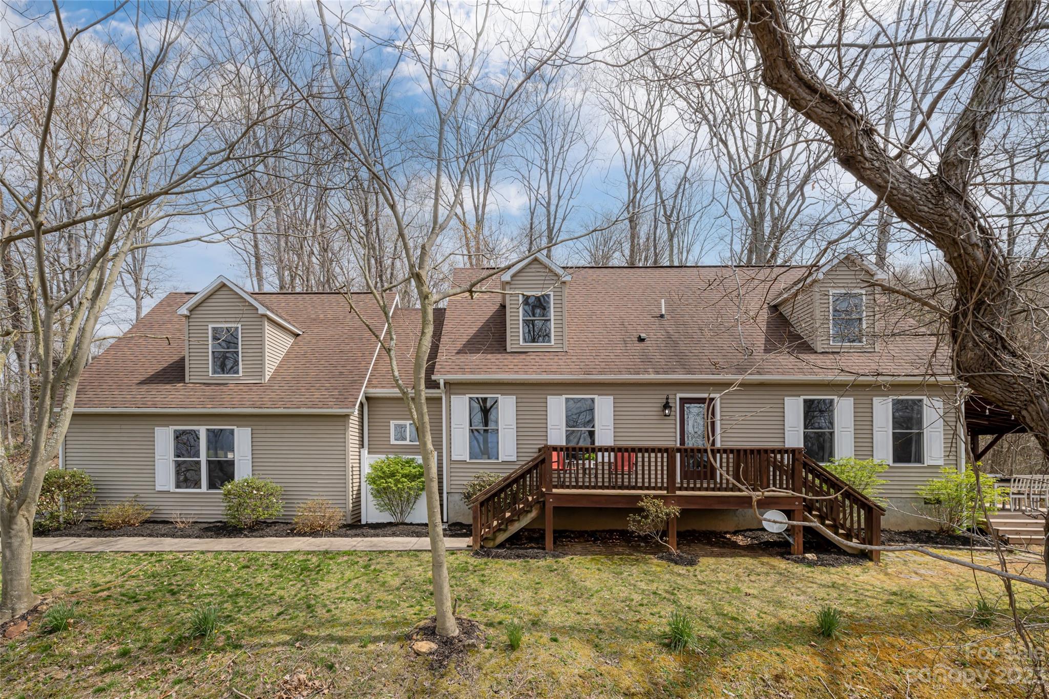 142 Blake Drive Canton, NC 28716 - Photo 44 of 44 a view of a white house and a large tree in front of a house
